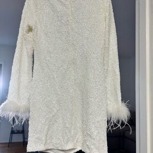 White sequin dress with feather trim